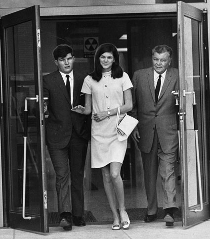 Barbara Jane Mackle leaves the courtroom with her father Robert and her brother