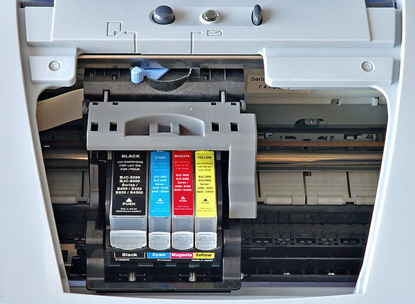 CMYK color cartridges inside an inkjet printer